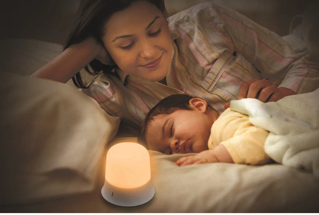 White bedside nursing night light with touch controls for dimming and colour selection.