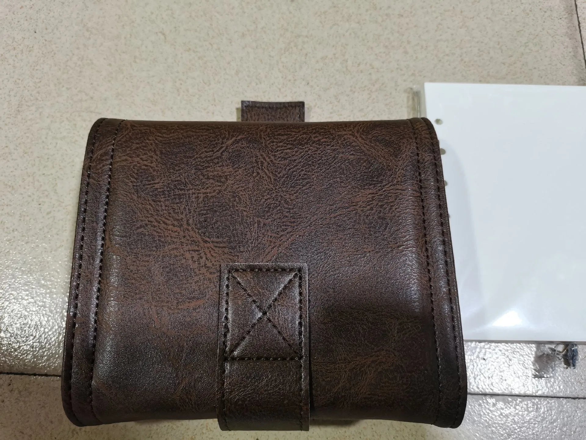 A7 brown PU notebook with loose-leaf binder binding showing 40g raw wood pulp paper inside