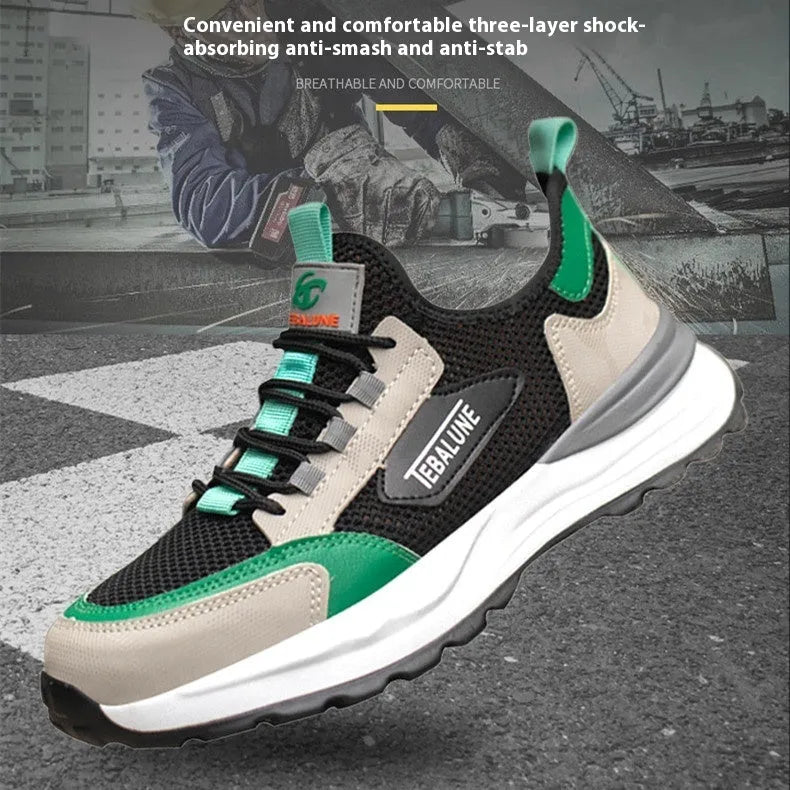 Black and green low-top safety shoes with mesh panels and a steel toe cap on a white background.