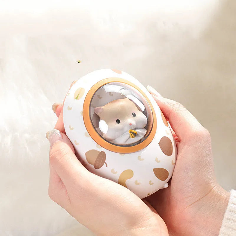 White hamster hand warmer power bank with space capsule design showing heating controls and USB ports