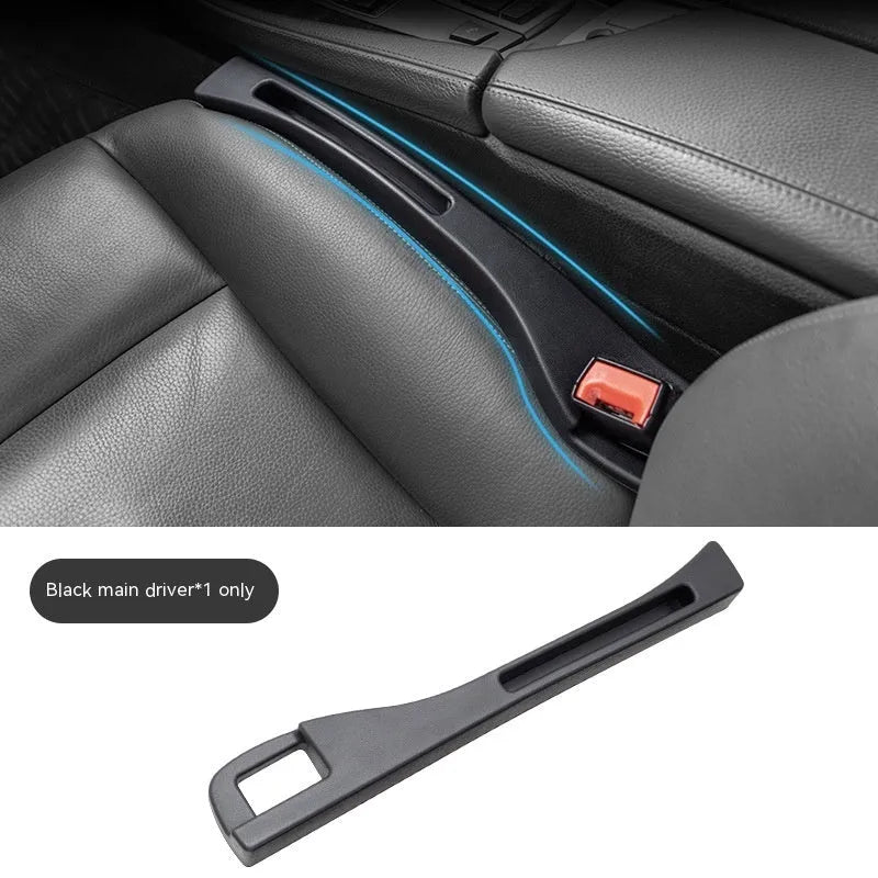 Black plastic storage box with handle placed in car seat gap.
