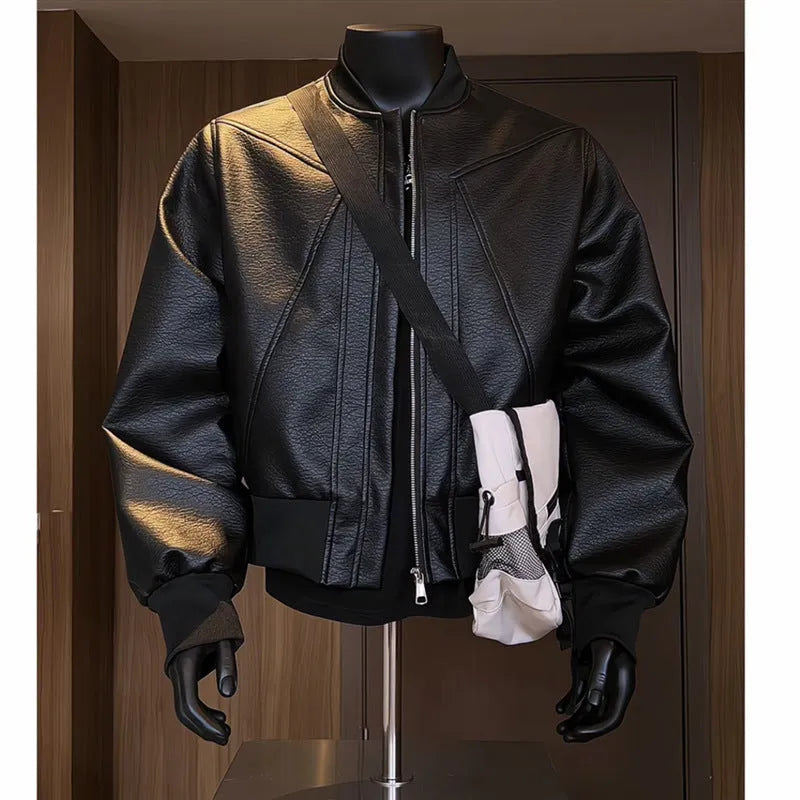 Man wearing a black PU leather jacket with litchi grain texture, showcasing its 100cm extended length and light business style fit.