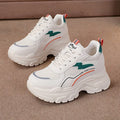 Women's low-top dad shoes in beige with cross shoulder straps, rubber sole, and breathable mesh upper
