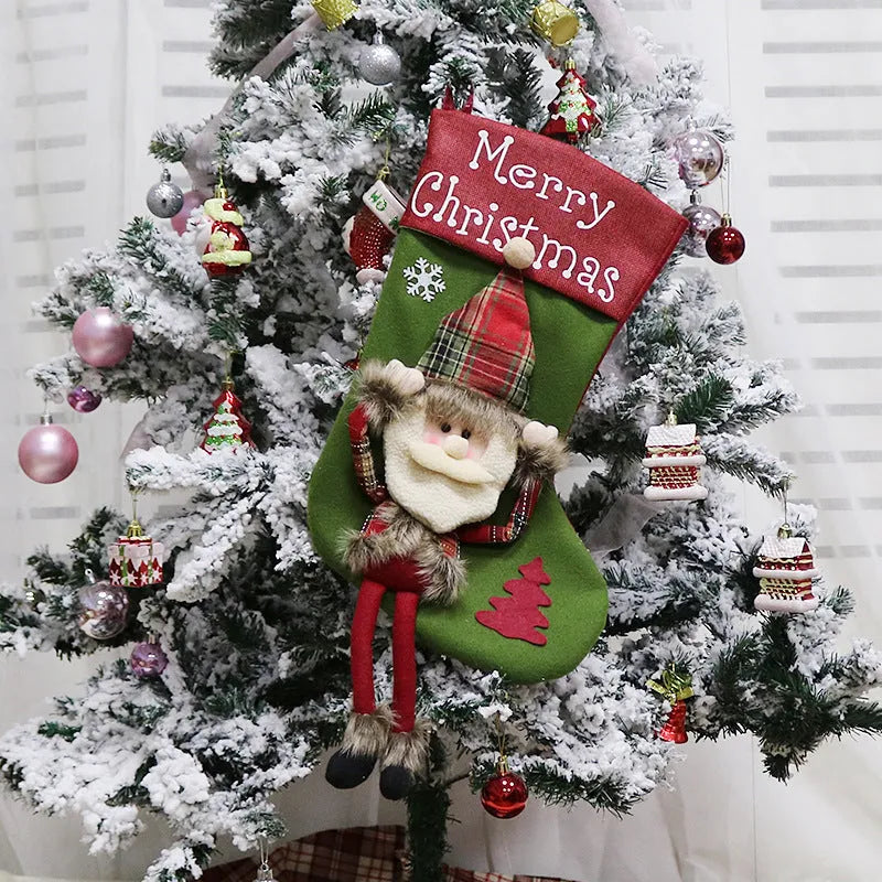 Three large Christmas stockings with Santa, Snowman, and Reindeer 3D applique designs in non-woven fabric