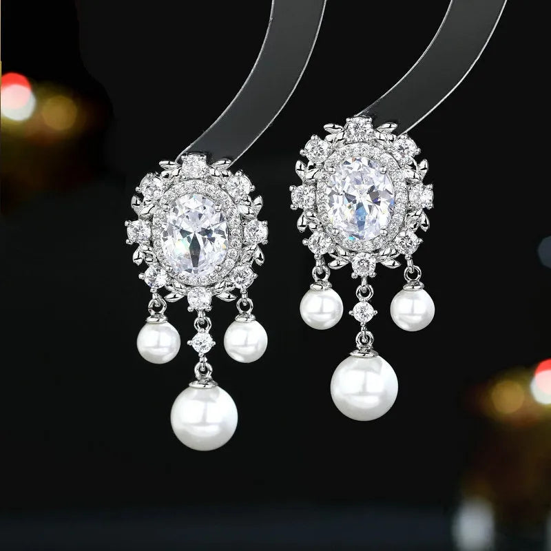 Oval zircon inlaid pearl tassel earrings with geometric copper design and 2.5cm drop