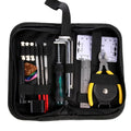 Black guitar repair kit case open showing metal and plastic tools including truss rod wrench, fret files, and string winder