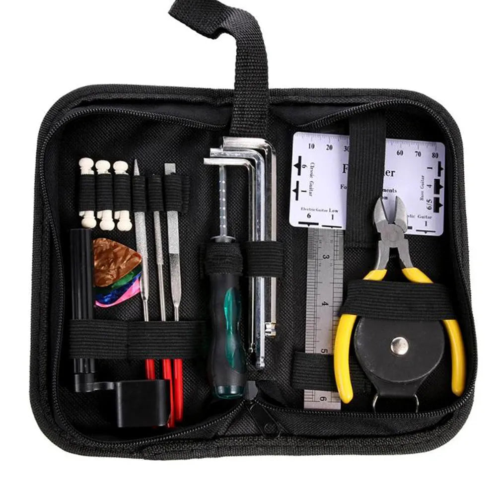 Black guitar repair kit case open showing metal and plastic tools including truss rod wrench, fret files, and string winder