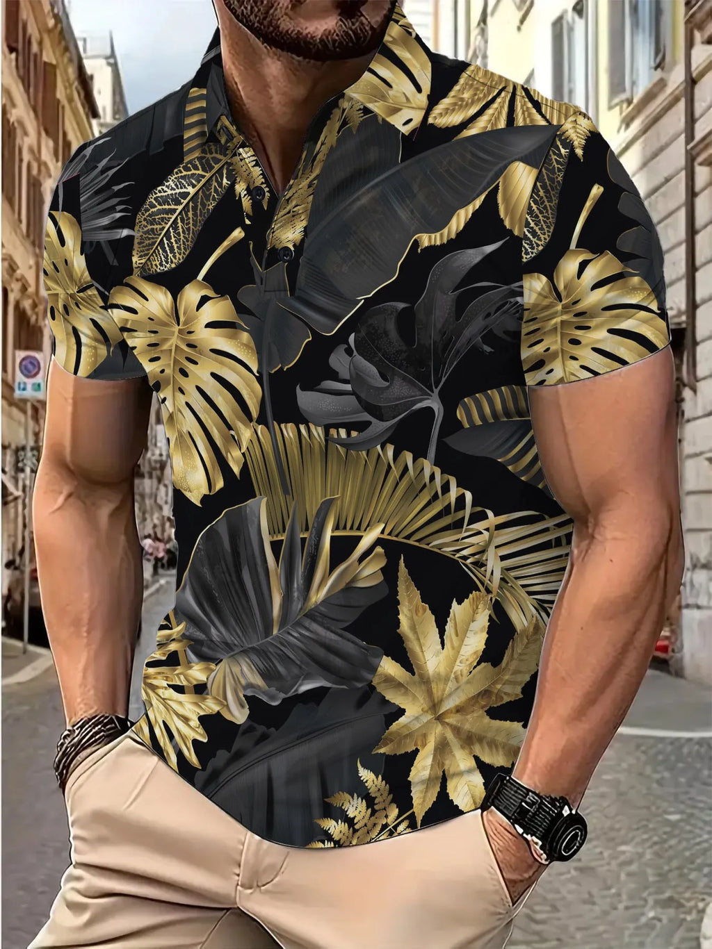 Men's gold short sleeve shirt with a large tropical leaf plant pattern print