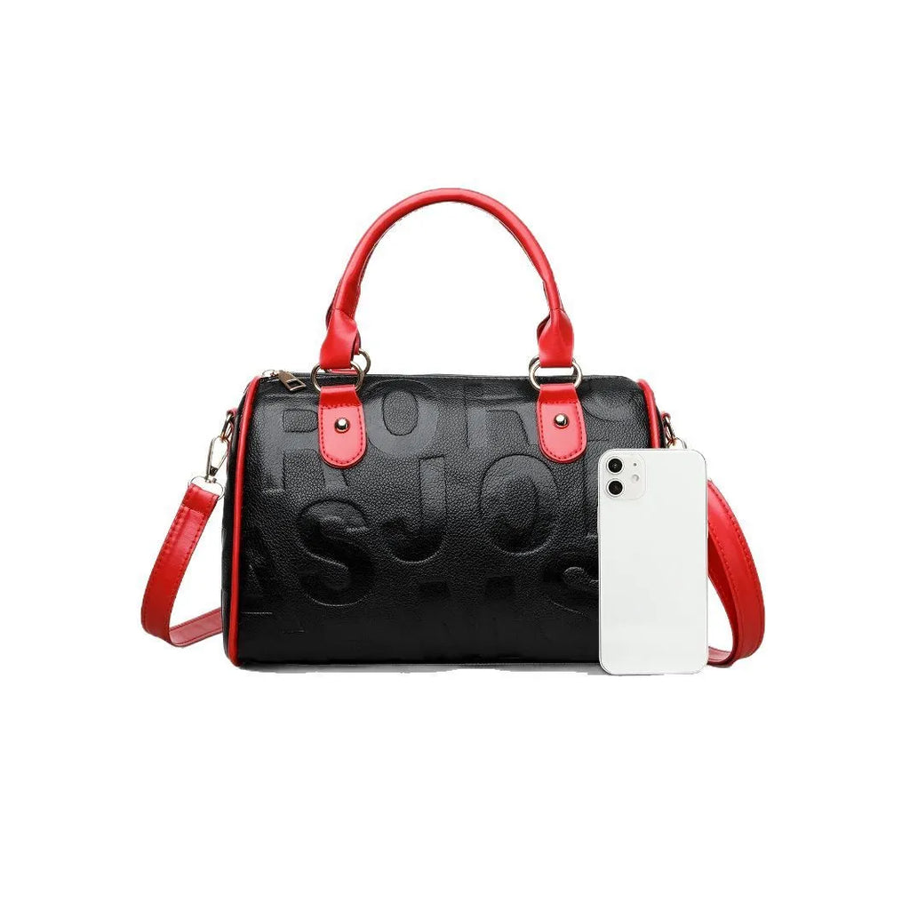 Brown cylindrical PU leather crossbody bag with three shoulder straps showing interior organisation