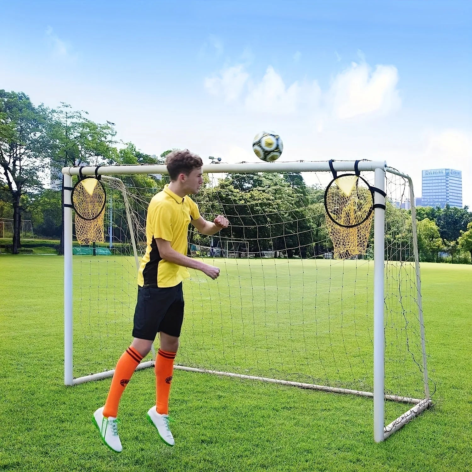 Portable aluminium frame soccer training goal net set up on grass
