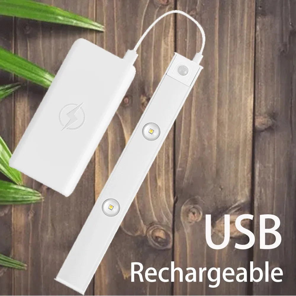 Ultra-thin USB LED night light with motion sensor in silver or black, showing magnet attachment for cabinets