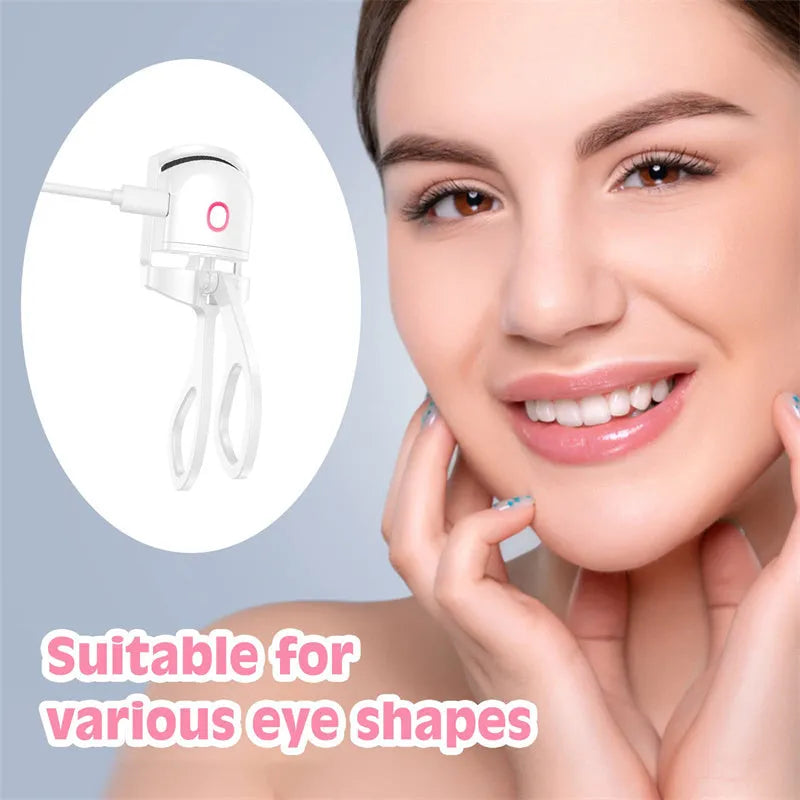 Pink and white USB rechargeable heated eyelash curler with dual temperature settings.