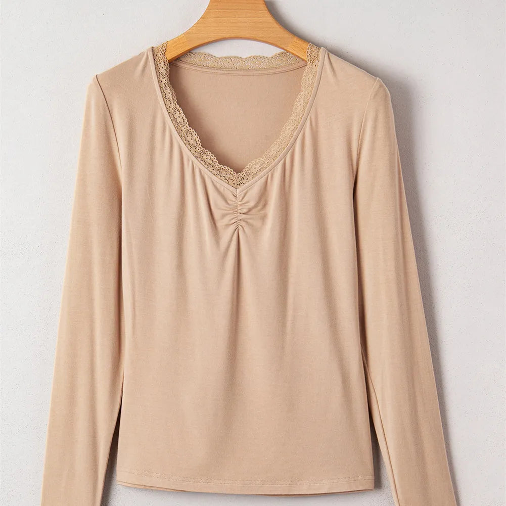 Red women's slim fit long sleeve casual top with lace trim detail on a hanger.