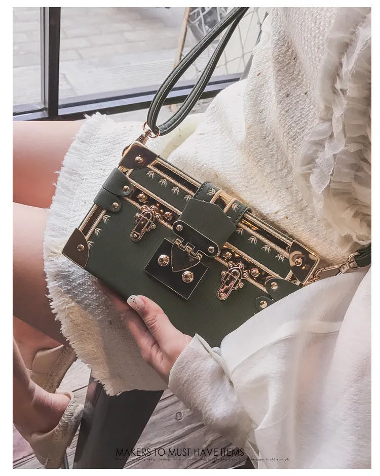 Women's hard PU shoulder bag with flap closure and single strap in black or green, showing rivet decoration