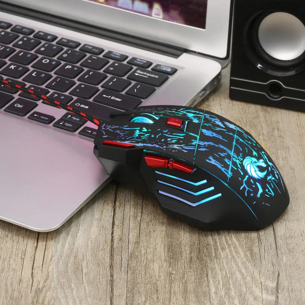 Water crack colourful luminous gaming mouse with USB cable on desktop surface