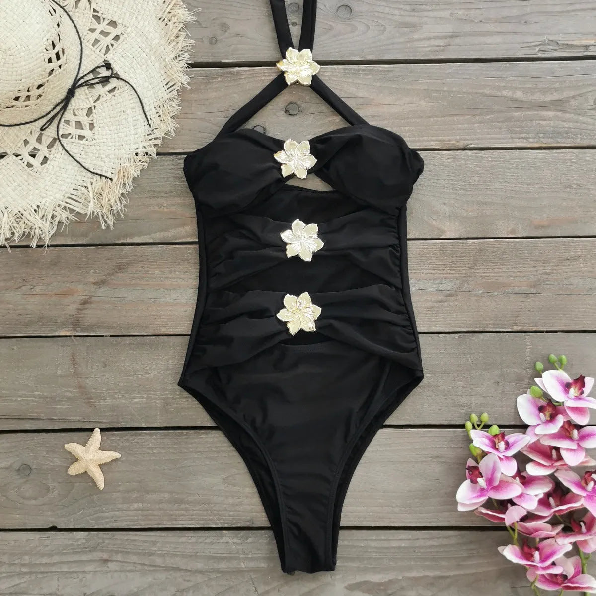 Women's solid colour one-piece swimsuit with detachable skirt showing high-waist design and hollow-out tube top detail