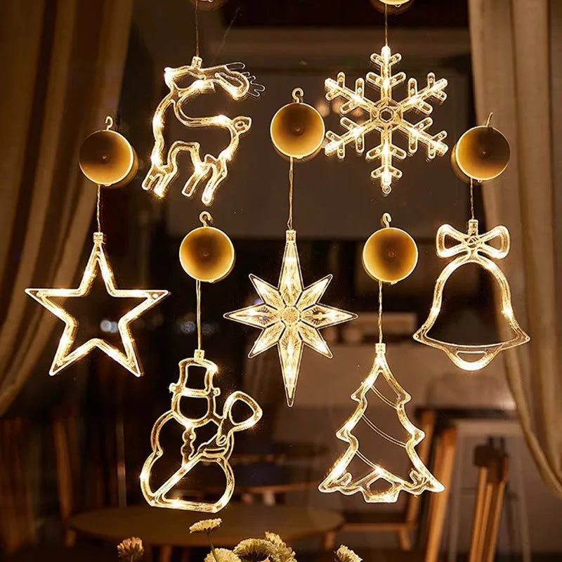 Battery-powered Christmas LED light set with Santa Claus, elk, and snowman designs stuck to a window with suction cups.