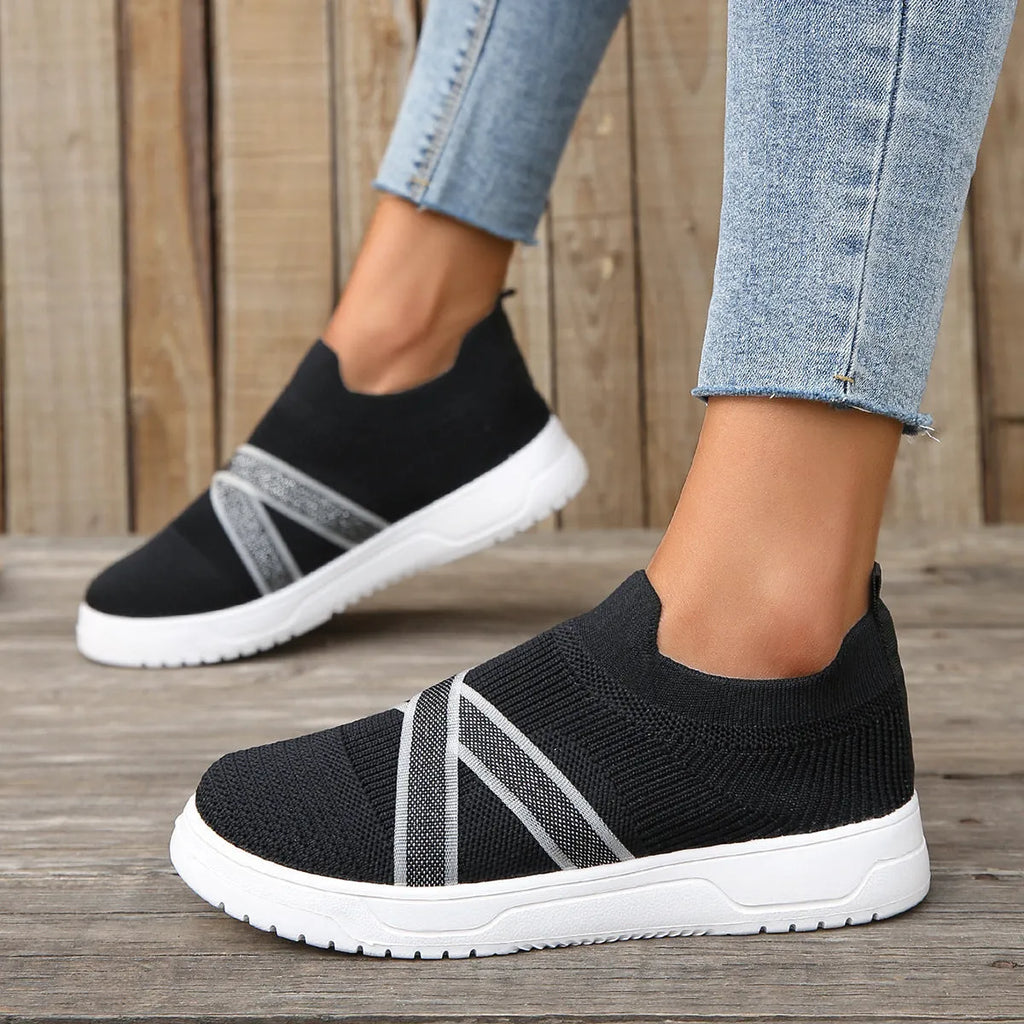 Women's black flyknit mesh casual shoes with flat rubber sole and tassel detail