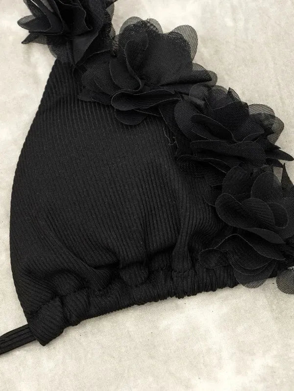 Black women's two-piece bikini set with a gathered swim top and matching shorts.