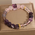 Women's purple amethyst crystal bracelet with rhinestone accents showing 10mm stones