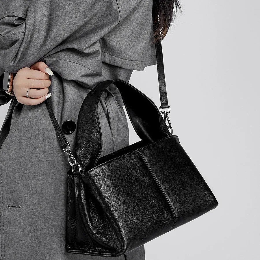 Women's genuine leather messenger bag in horizontal square shape with double shoulder straps and organised compartments