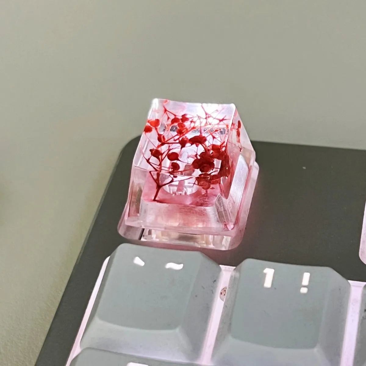 Translucent resin starry sky keycap with glitter particles measuring 1.8cm by 1.2cm