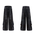 Black gradient denim coat with distressed raw edges and padded shoulders, worn with matching black denim trousers.