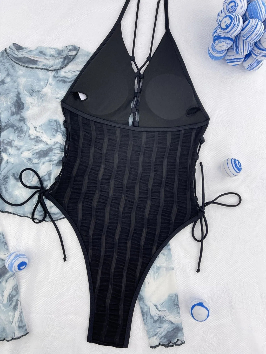 Black one-piece women's swimsuit with solid colour design
