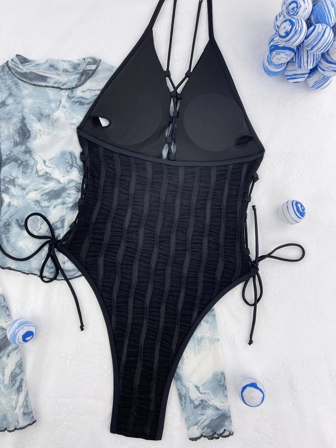 Black one-piece women's swimsuit with solid colour design