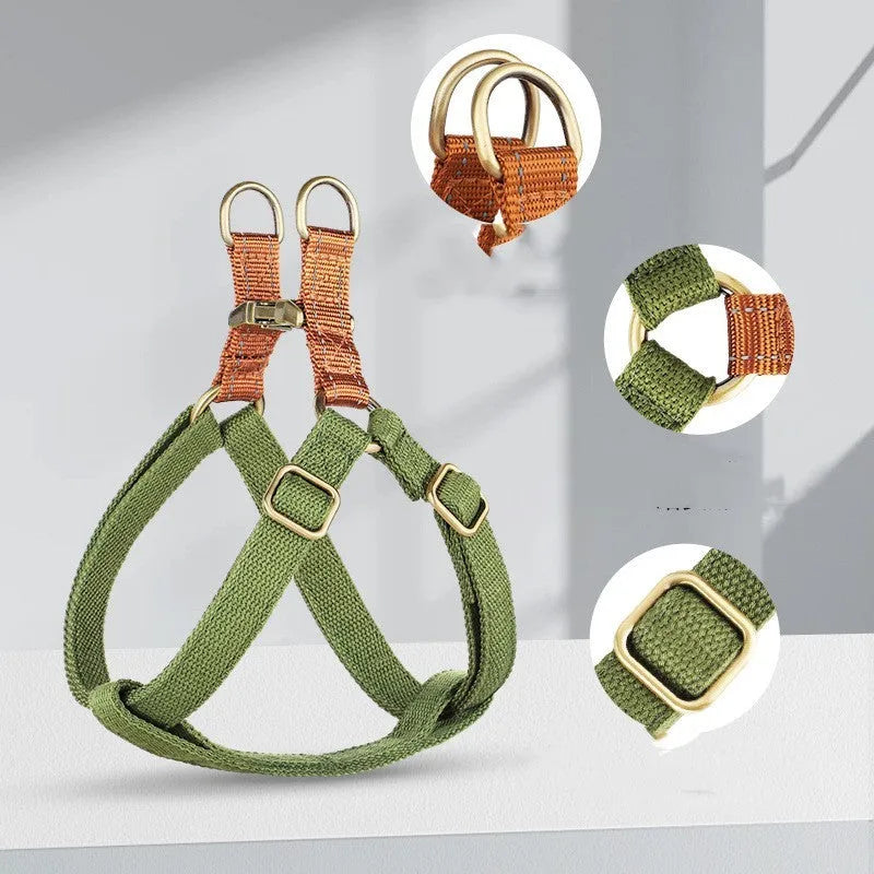 Brown vest-style dog leash worn on a person, showing the cotton belt and alloy fastener.