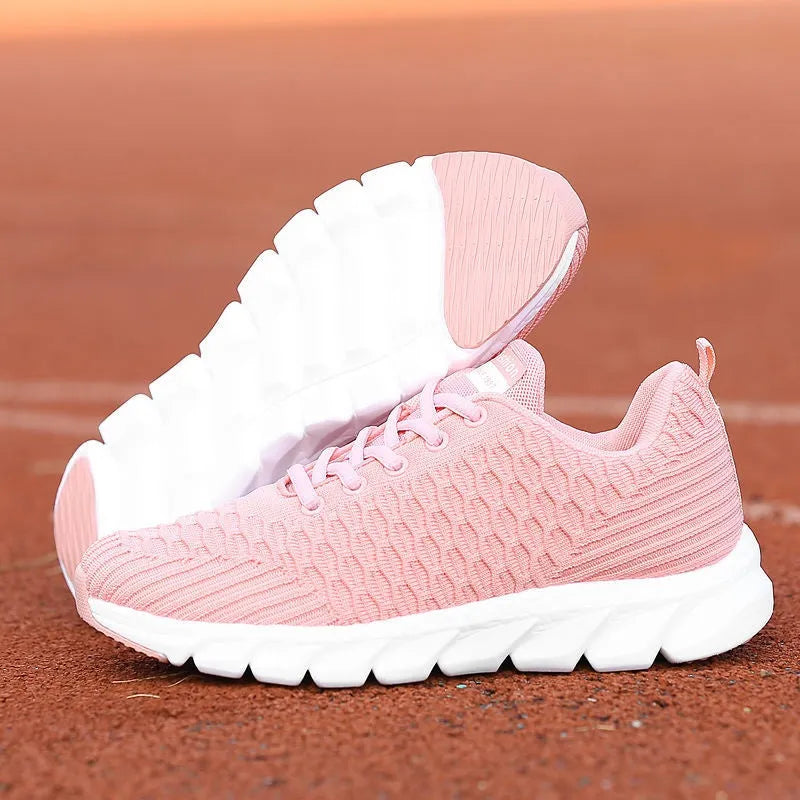 Women's running shoes with fly weaving upper in black, pink, or white, showing wear-resistant outsole