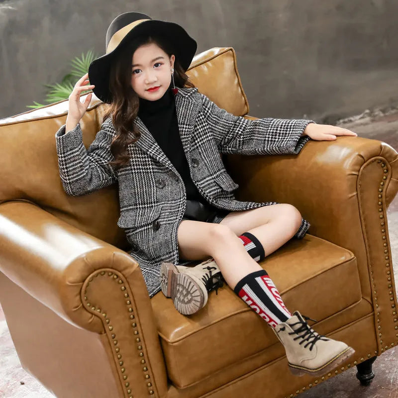 Girls grey and white houndstooth check coat with a suit collar and long sleeves.