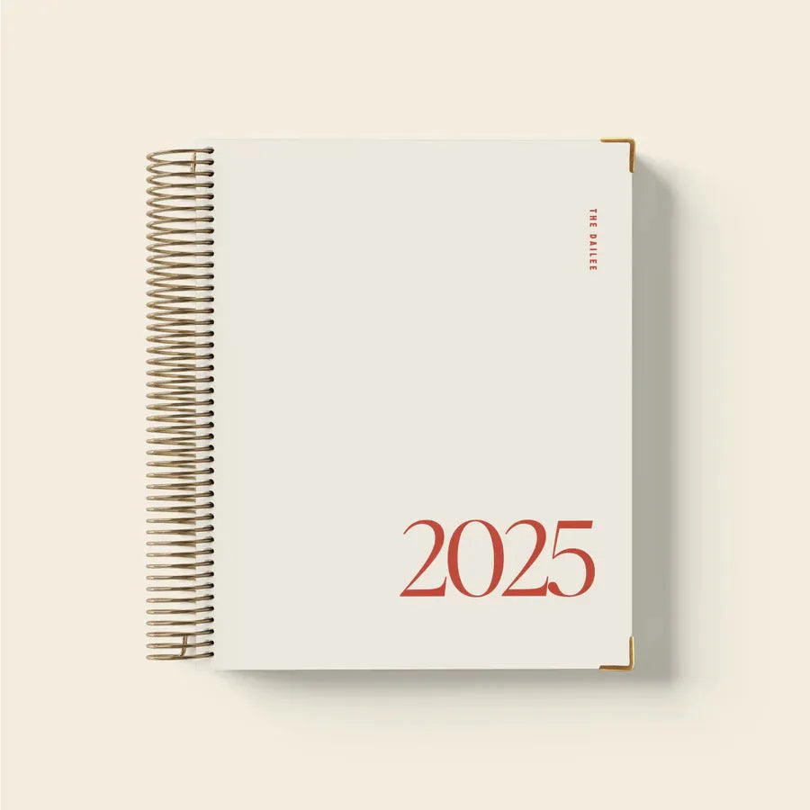 Cherry Red A5 coil notebook showing weekly schedule layout with spiral binding and 80 sheets
