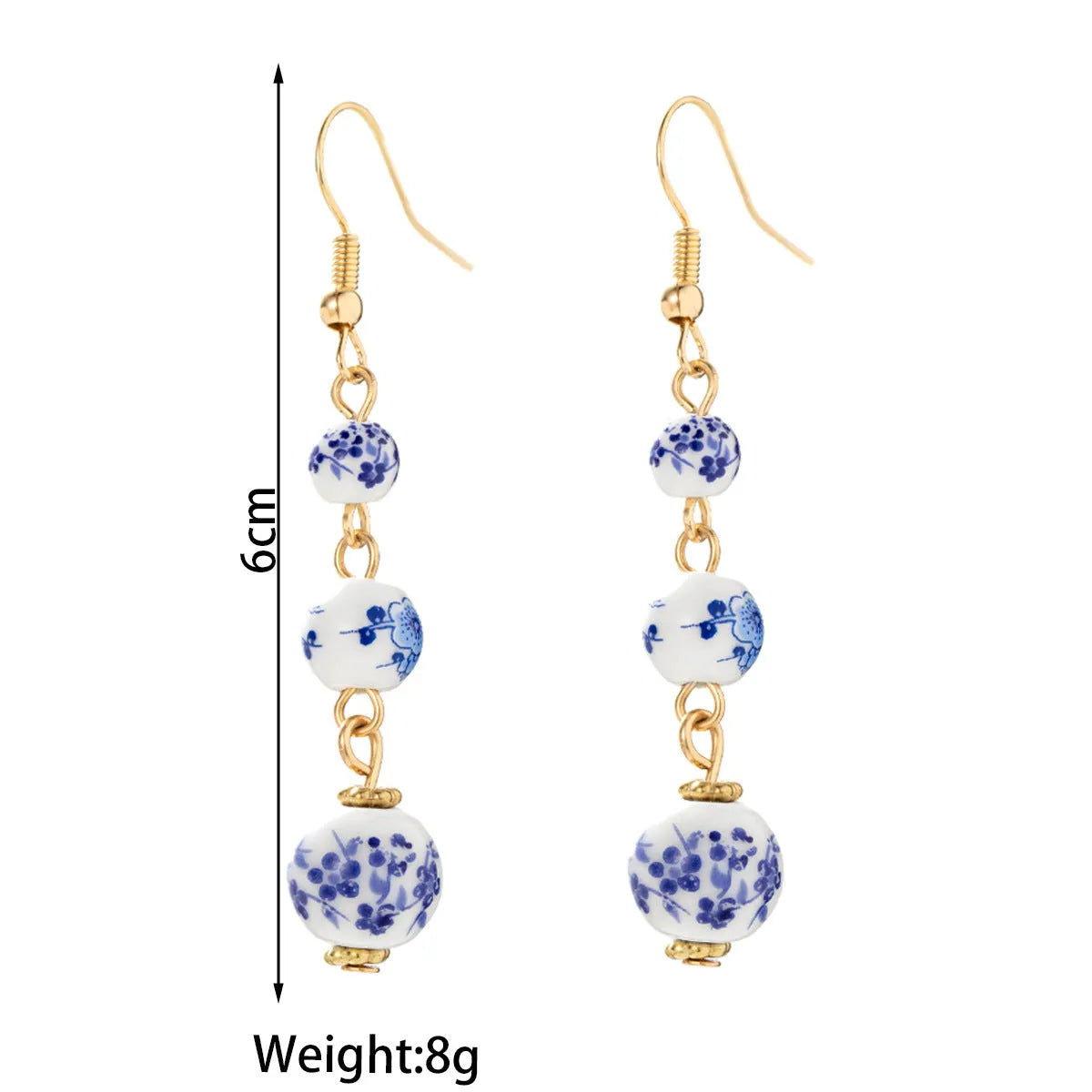 Long blue and white porcelain ceramic bead retro geometric earrings with alloy electroplated frame.