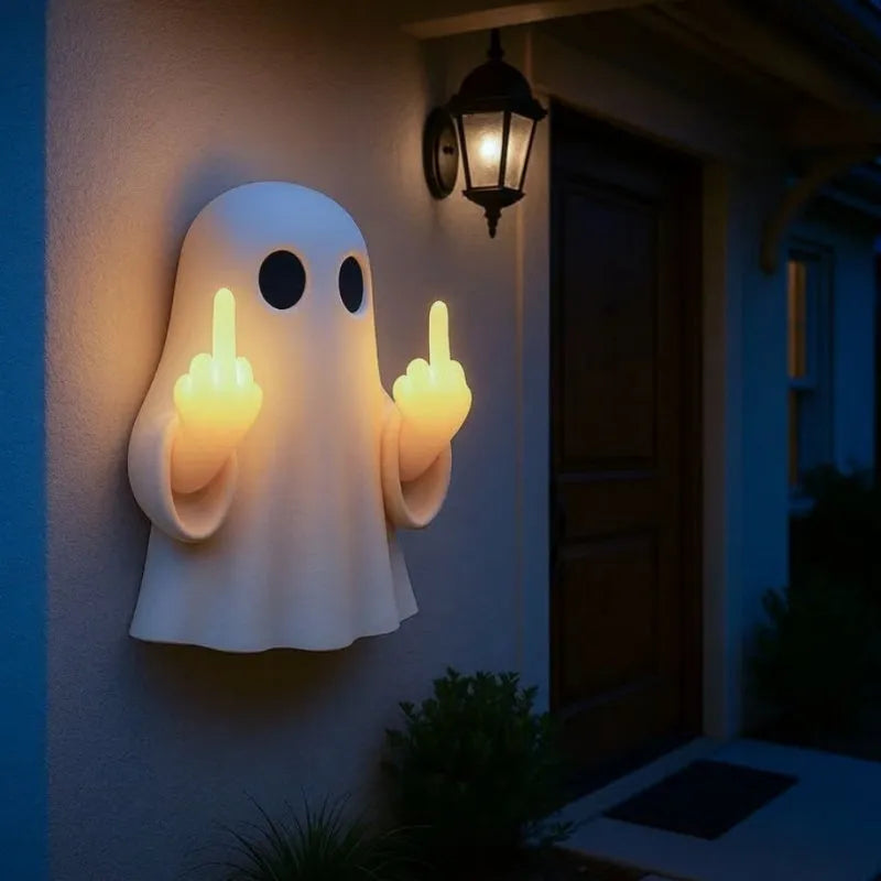 White ghost-shaped night lamp on table with soft glow, measuring 19.85cm tall for Halloween decor