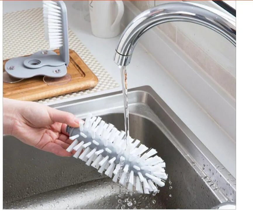 Grey rotating double-head cup cleaning brush with suction cups for wall mounting