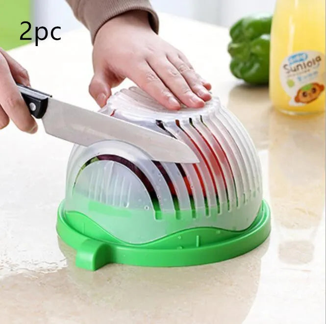 Blue BPA-free plastic salad cutter bowl with cutting grid lid on a white base with raised edges.