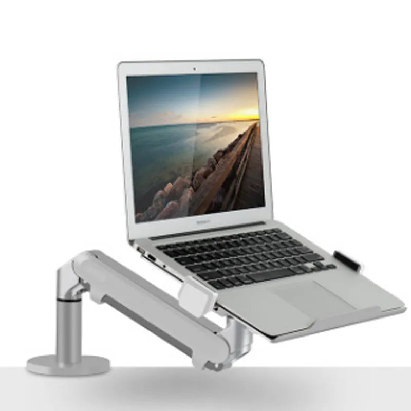 Silver aluminium alloy laptop stand with adjustable height and 360-degree rotation on a wooden desk