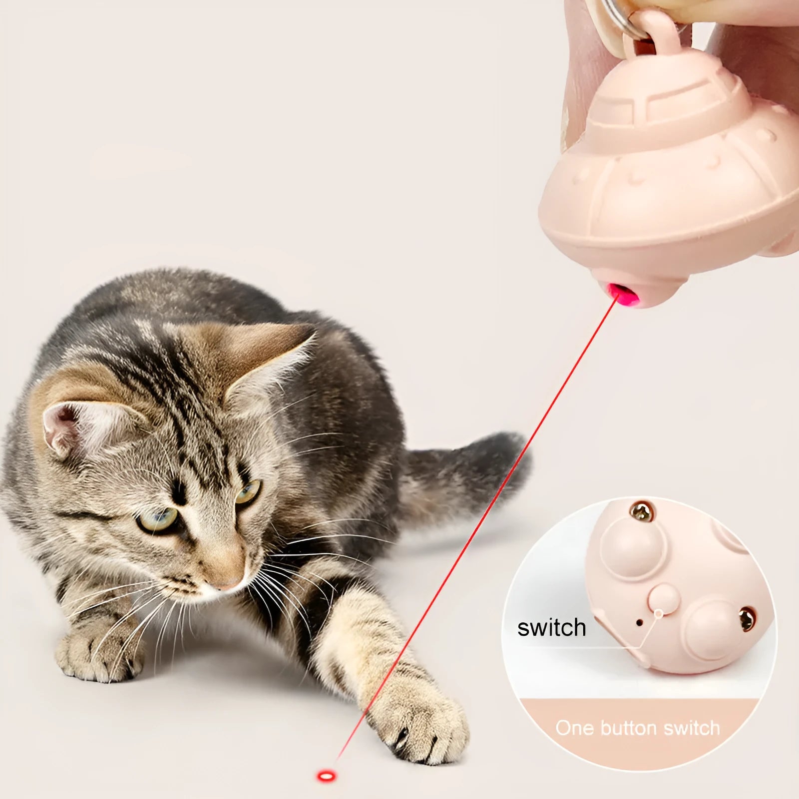 Small green plastic automatic laser toy attached to a cat collar for hands-free interactive pet play.