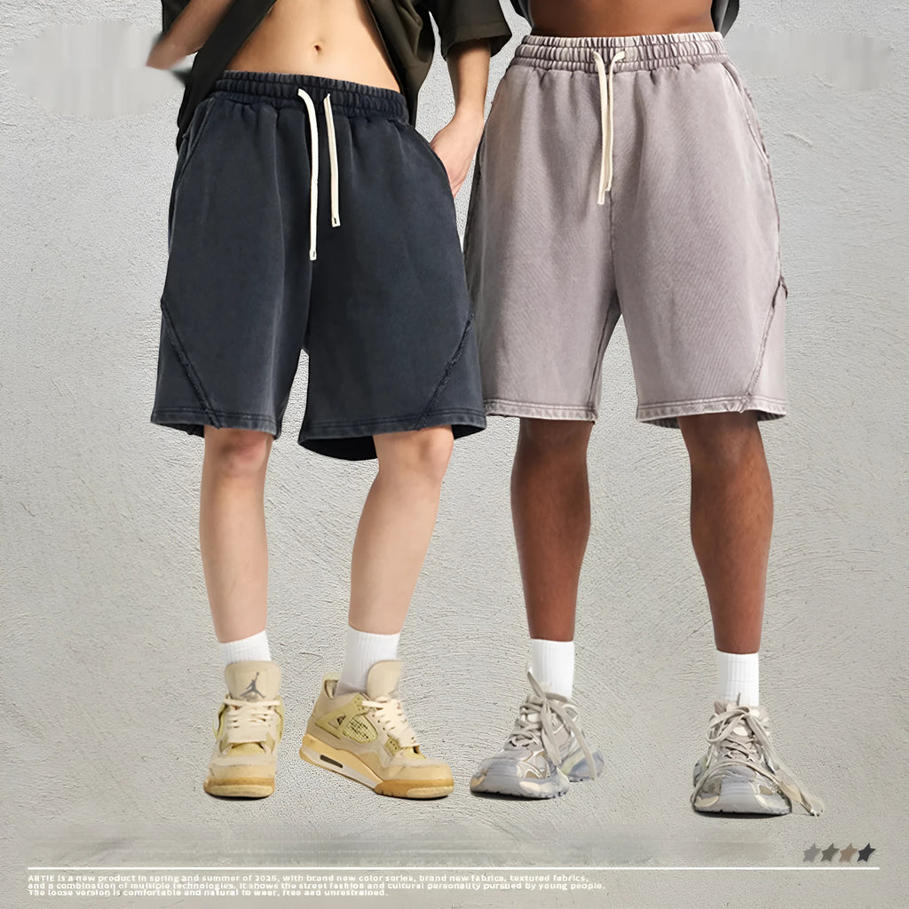 Men's loose fit retro shorts in batik washed cotton terry fabric, showing patch craft detail.