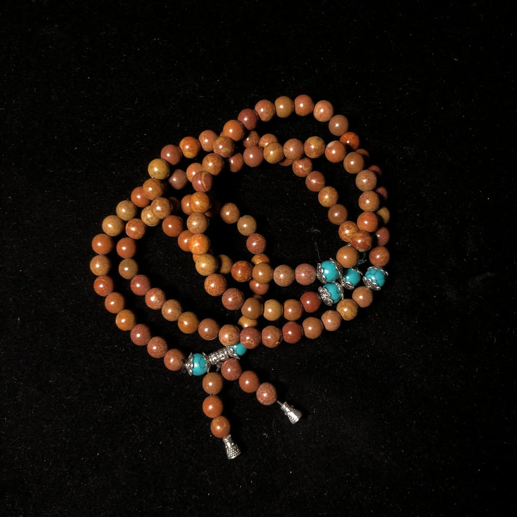 Handmade geometric stone bead bracelet with 108 polished beads in natural colour
