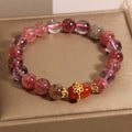 Super Seven crystal bracelet with white crystal and red agate accents on adjustable chain