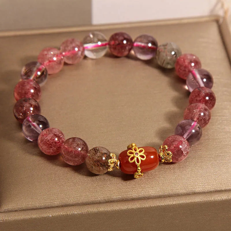 Super Seven crystal bracelet with white crystal and red agate accents on adjustable chain