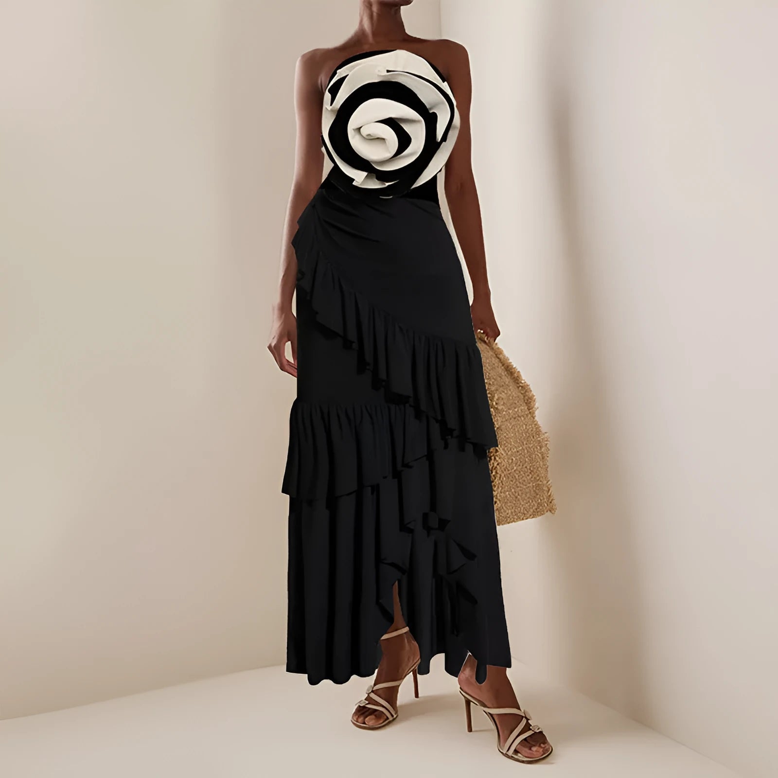 Women's black and white one-piece swimsuit with matching skirt cover-up on beach