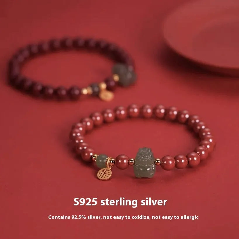 Hetian Jade Cinnabar Bracelet with 8mm beads showing Emperor Sandstone style and Zodiac animal modelling