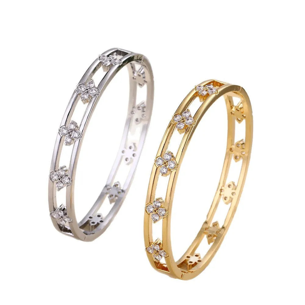 Gold and silver hollow women's bracelets with four-leaf clover charms and inlaid zircon detailing.