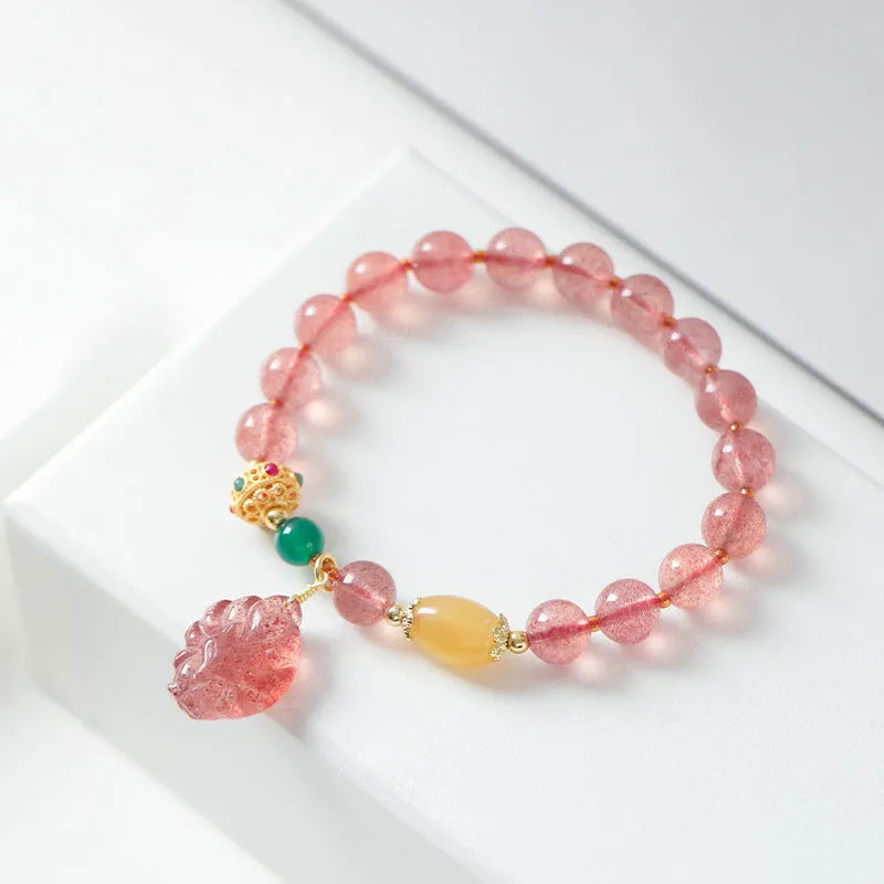 Women's polished crystal bracelet with Nine Tail Fox beaded design on a wrist.
