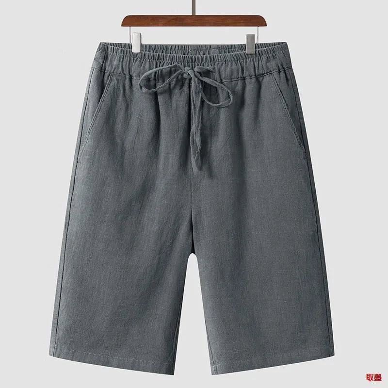 Men's loose linen shorts in beige colour with cropped length and elastic waistband