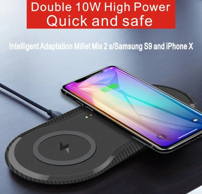 Black and white dual 10W wireless charger charging two phones simultaneously on silicone anti-slip base