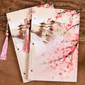 Chinese style thread-bound notebook with watercolour azalea design on cover, showing traditional binding